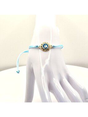 Evil Eye Adjustable Bracelet With Gold-Tone Charm & Light Blue Cord